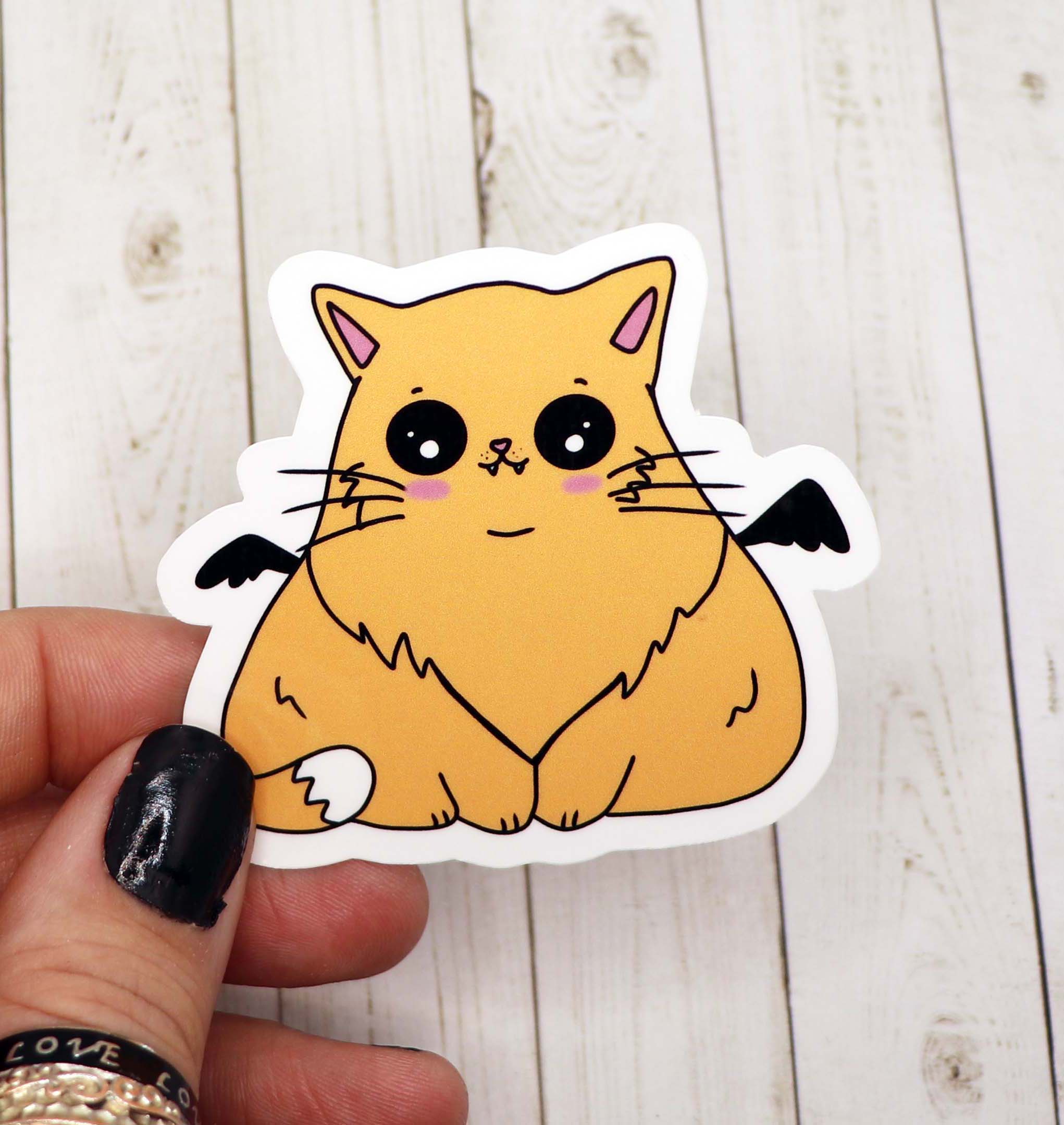 A cute Cat Bat Vinyl Sticker featuring a whimsical design, perfect for decorating various surfaces.