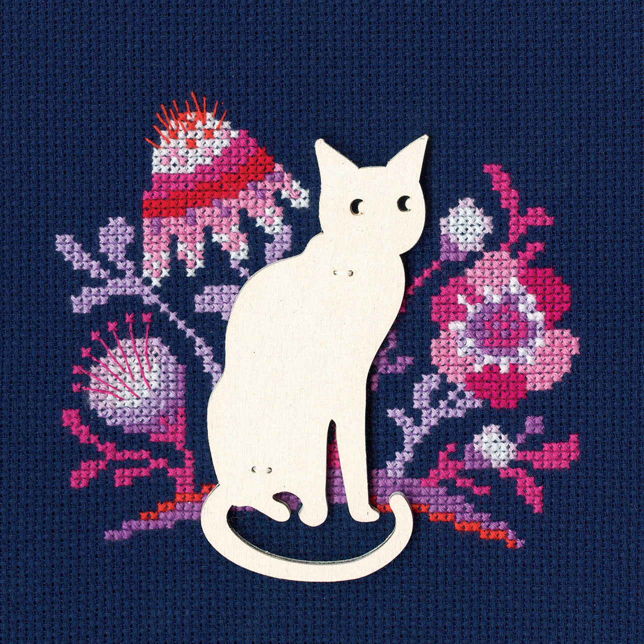 Cat CBE9005 cross stitch kit featuring blue Aida 14 canvas, 100% cotton threads, and a plywood form for display.