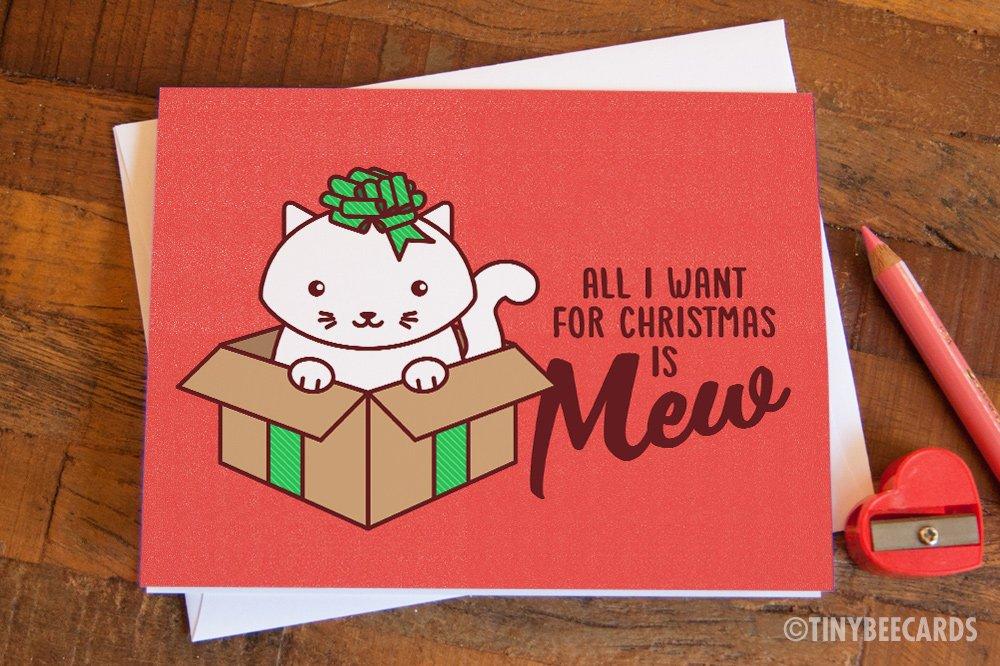 Cat Christmas Card featuring a cute cat in a holiday box with a bow, perfect for sending festive greetings.