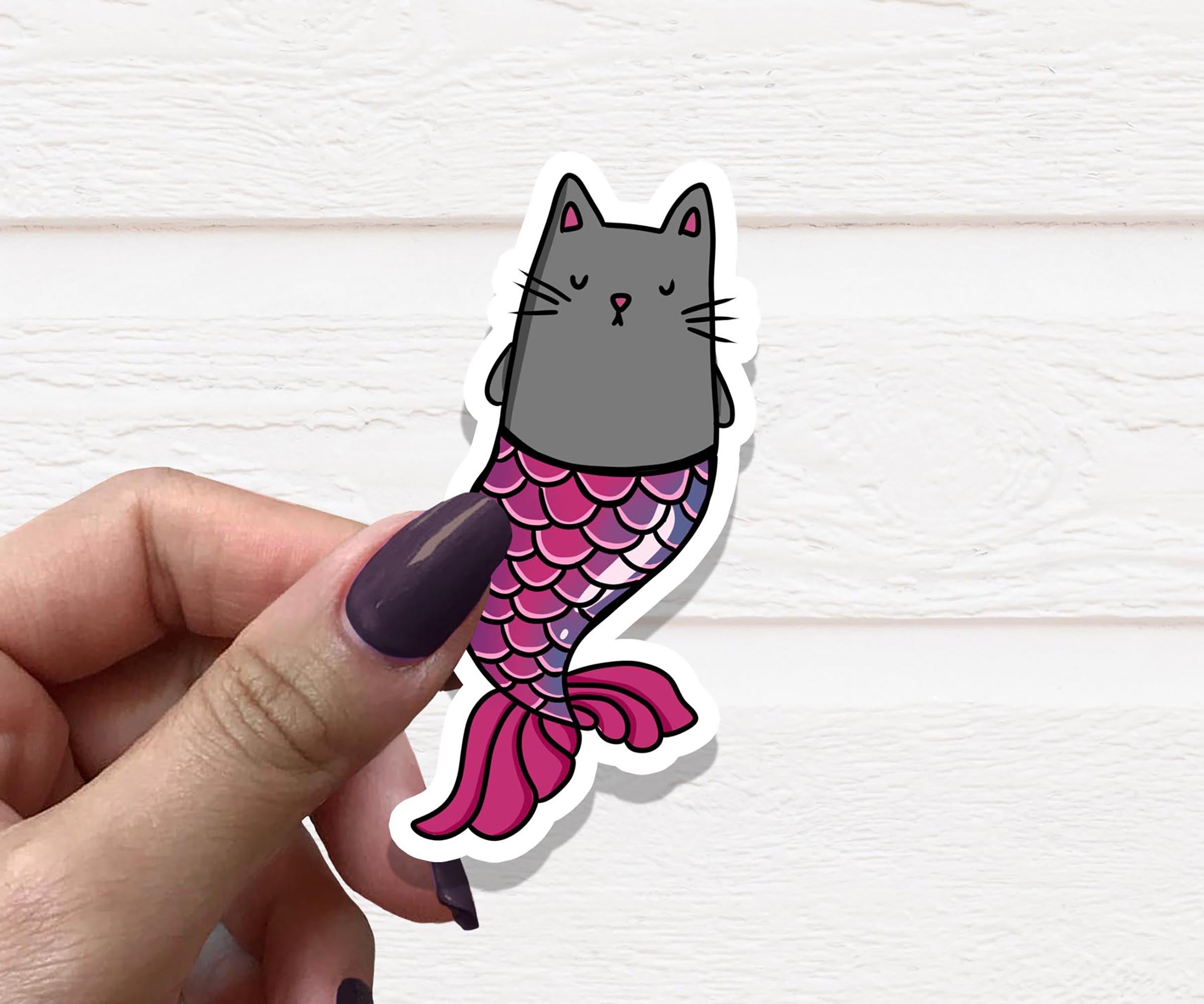 A colorful Cat Mermaid Vinyl Sticker featuring a whimsical cat with mermaid tail design, perfect for personalizing various items.