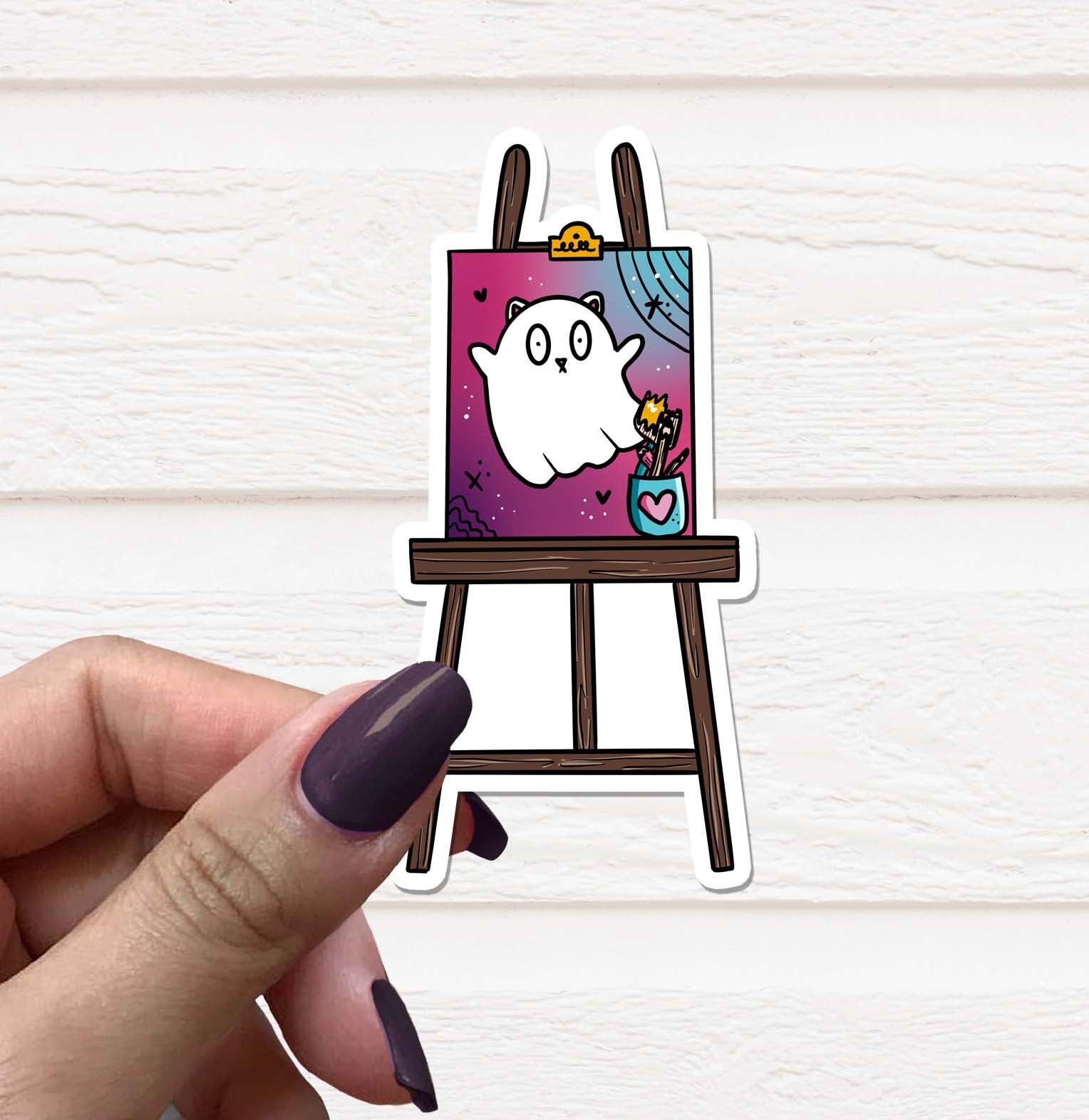 A colorful Cat Painting Vinyl Sticker featuring a whimsical cat design on a matte background, ideal for personalizing various items.