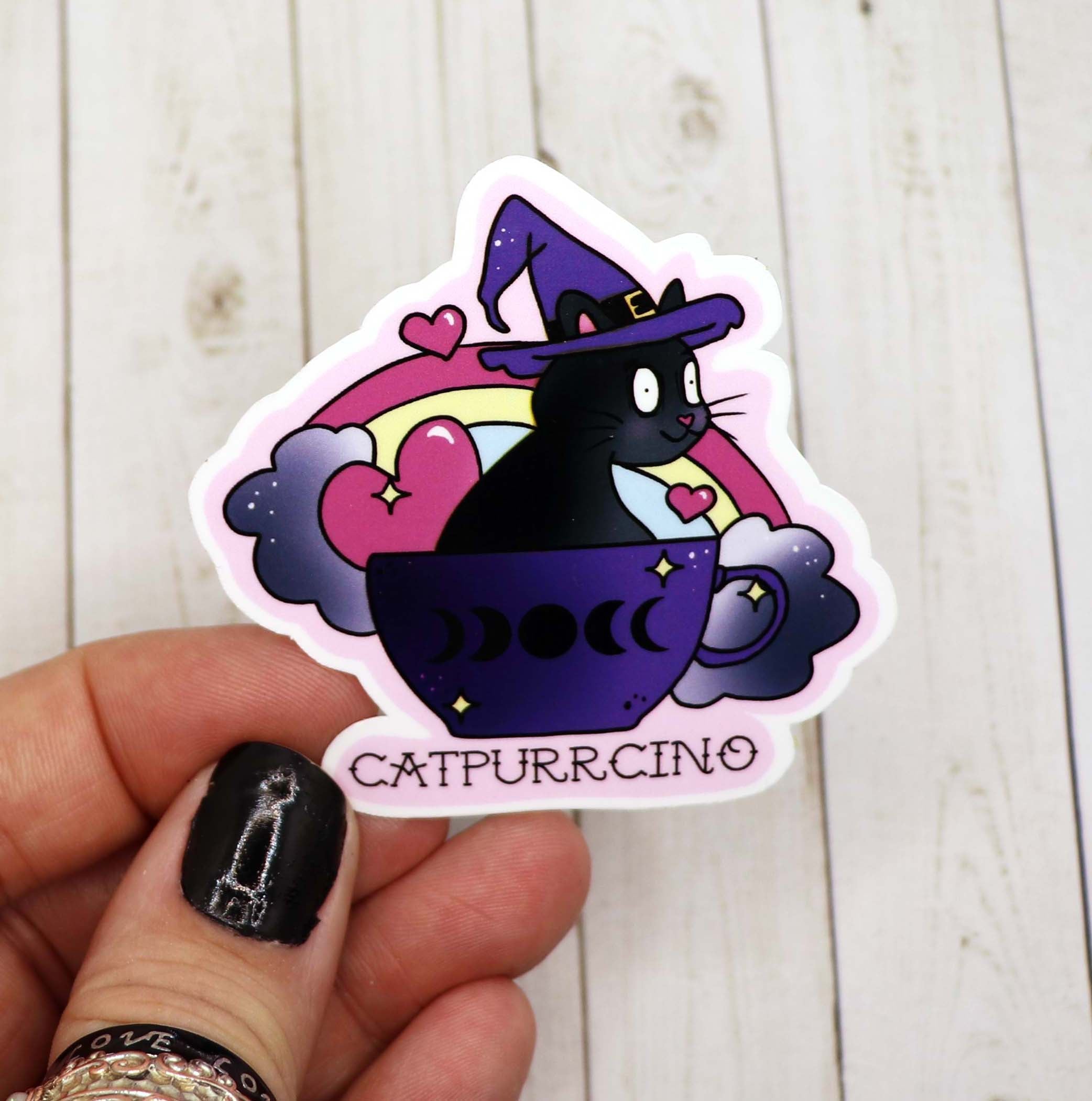 A colorful Catpurrcino Sticker featuring a cute cat design, perfect for personalizing various items.