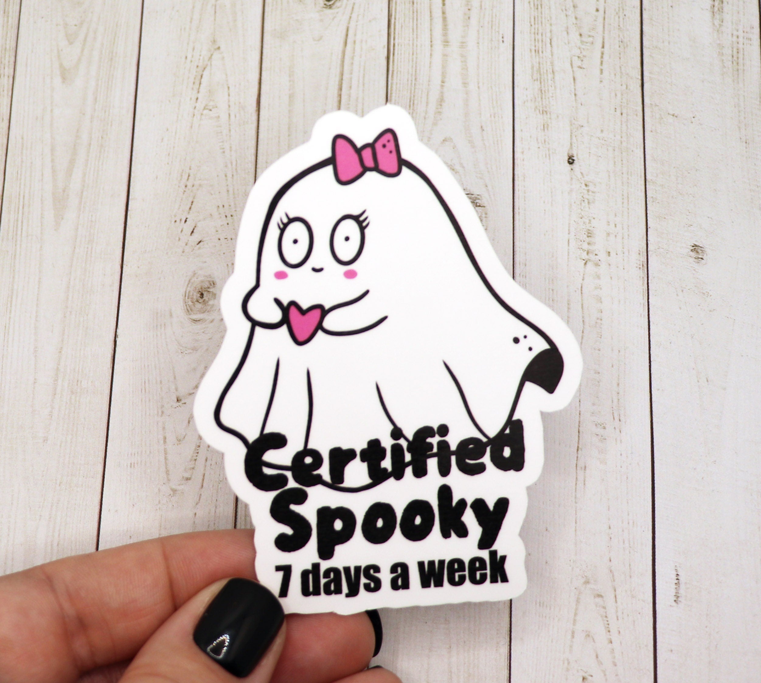 A vibrant Certified Spooky 7 Days a Week Vinyl Sticker featuring a playful design, perfect for personalizing various items.