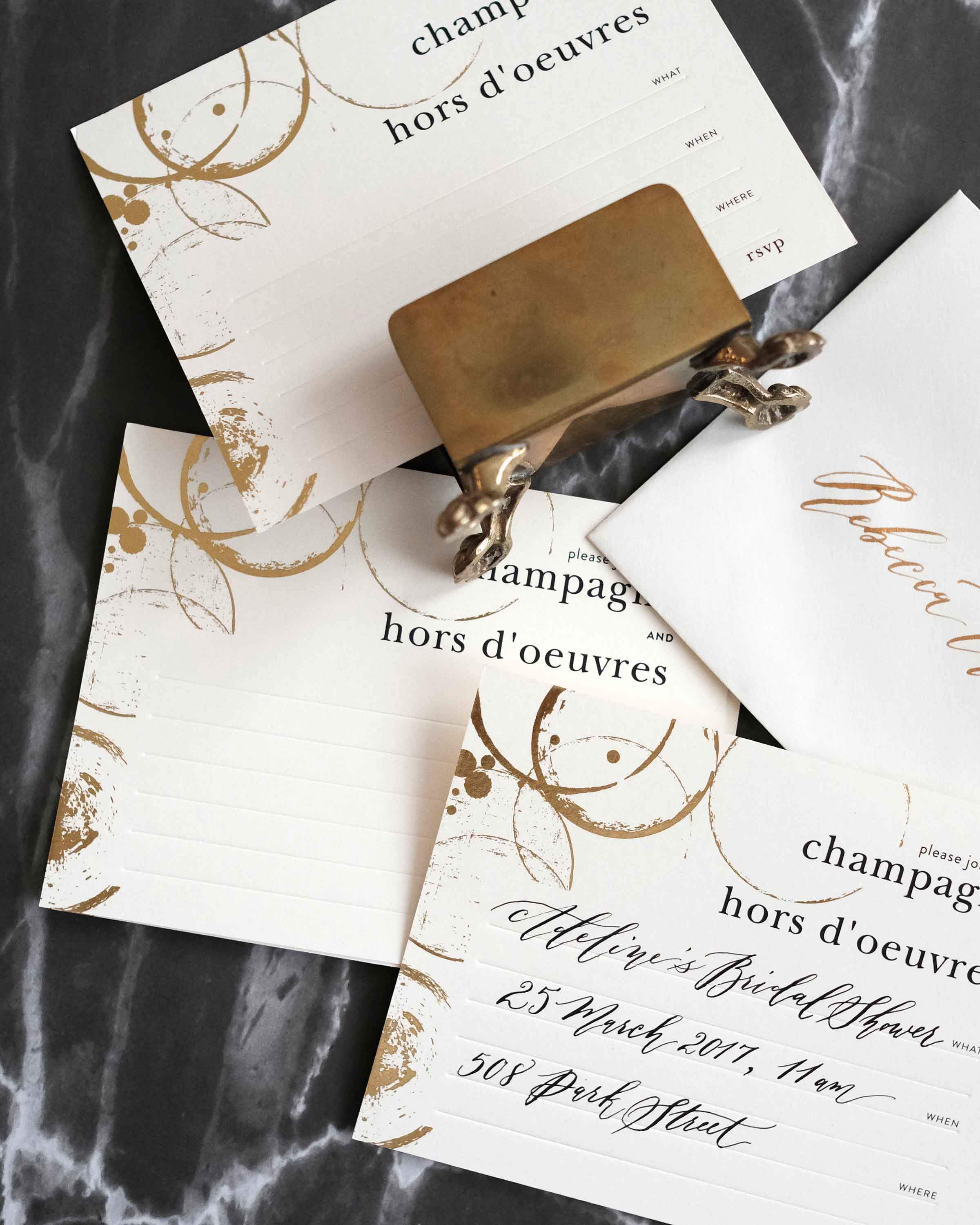 A stylish box set of Champagne & Hors D'oeuvres Invitations featuring elegant black deboss finish and lined envelopes.