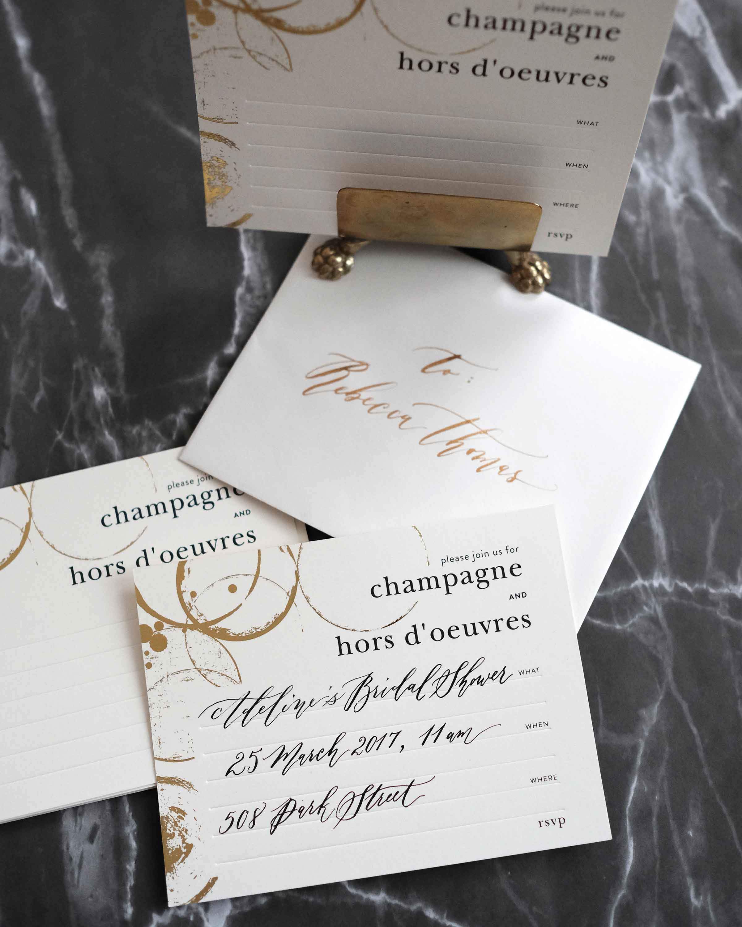 A stylish box set of Champagne & Hors D'oeuvres Invitations featuring elegant black deboss finish and lined envelopes.