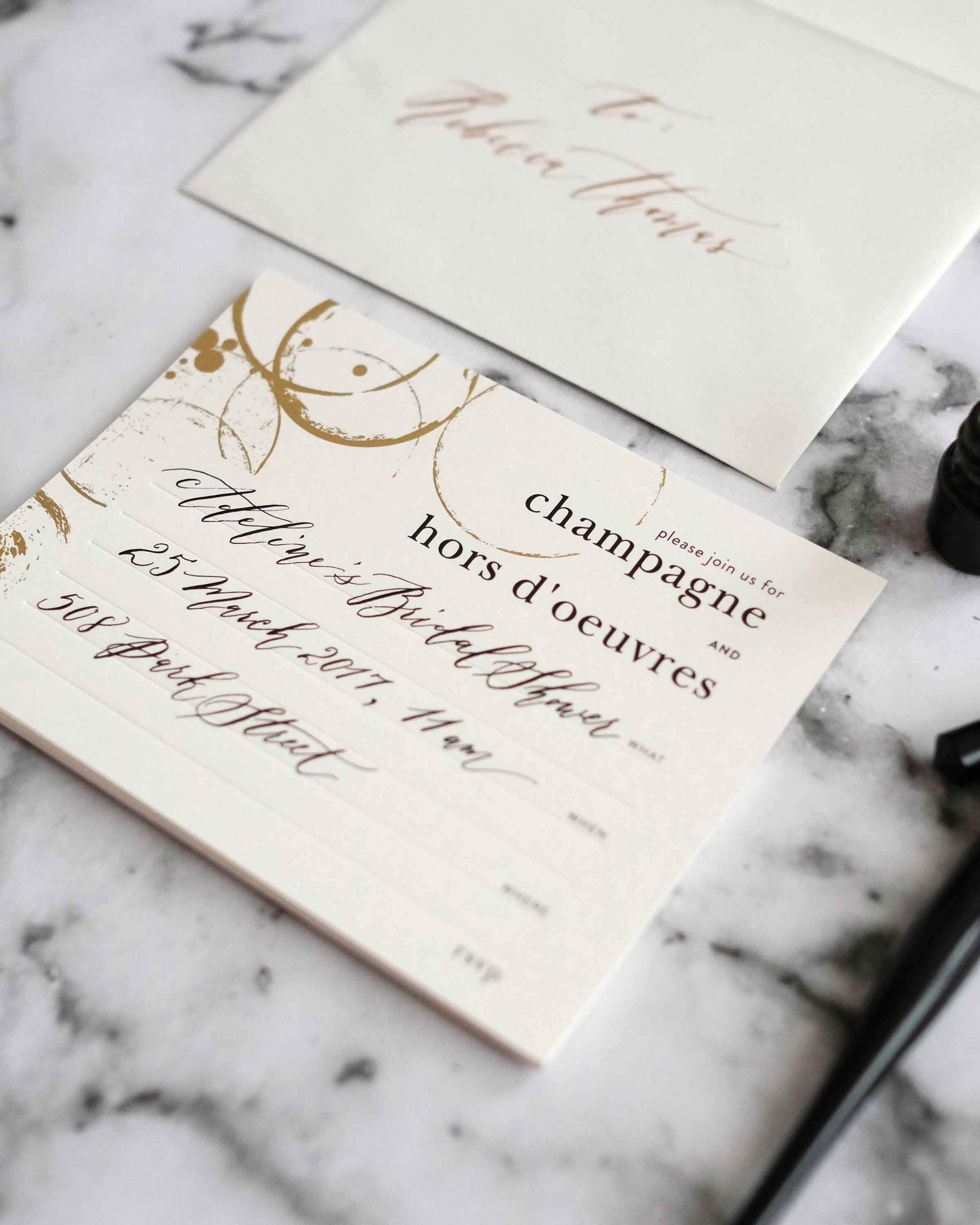 A stylish box set of Champagne & Hors D'oeuvres Invitations featuring elegant black deboss finish and lined envelopes.