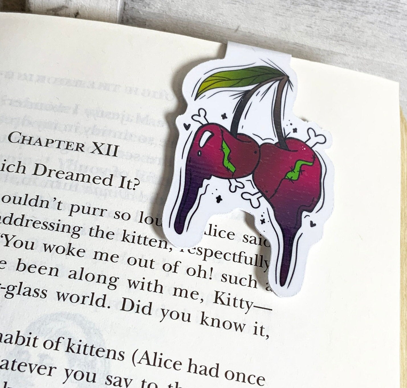 Cherries Magnetic Bookmark featuring vibrant cherry design, double-sided, and strong magnets for secure page holding.