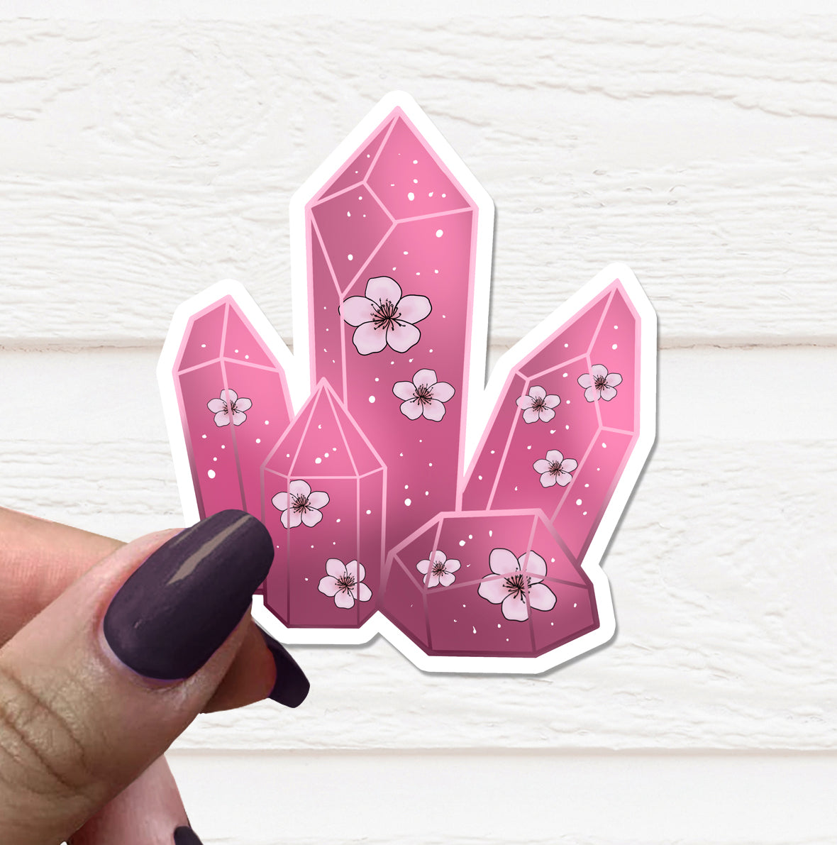 A vibrant Cherry Blossom Crystal Vinyl Sticker featuring delicate pink cherry blossoms on a matte background, perfect for personalizing various items.