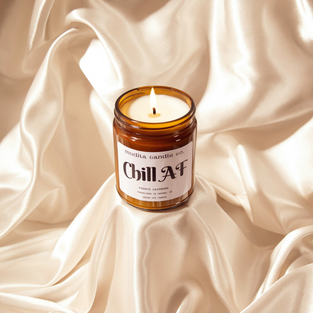 Chill AF French Lavender Soy Candle in amber glass jar with gold lid, showcasing its elegant design and soothing lavender color.