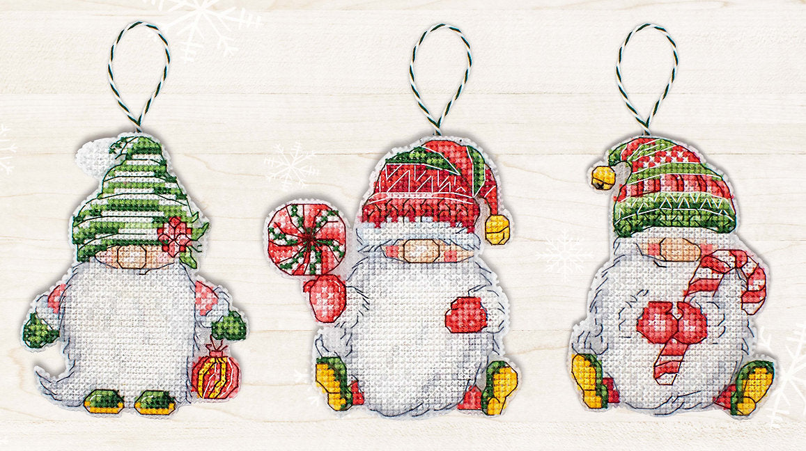 Christmas Gnomes JK030L Counted Cross-Stitch Kit featuring colorful threads, Aida canvas, and needle for festive crafting.