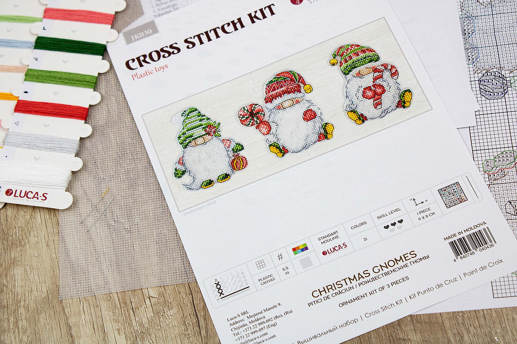 Christmas Gnomes JK030L Counted Cross-Stitch Kit featuring colorful threads, Aida canvas, and needle for festive crafting.