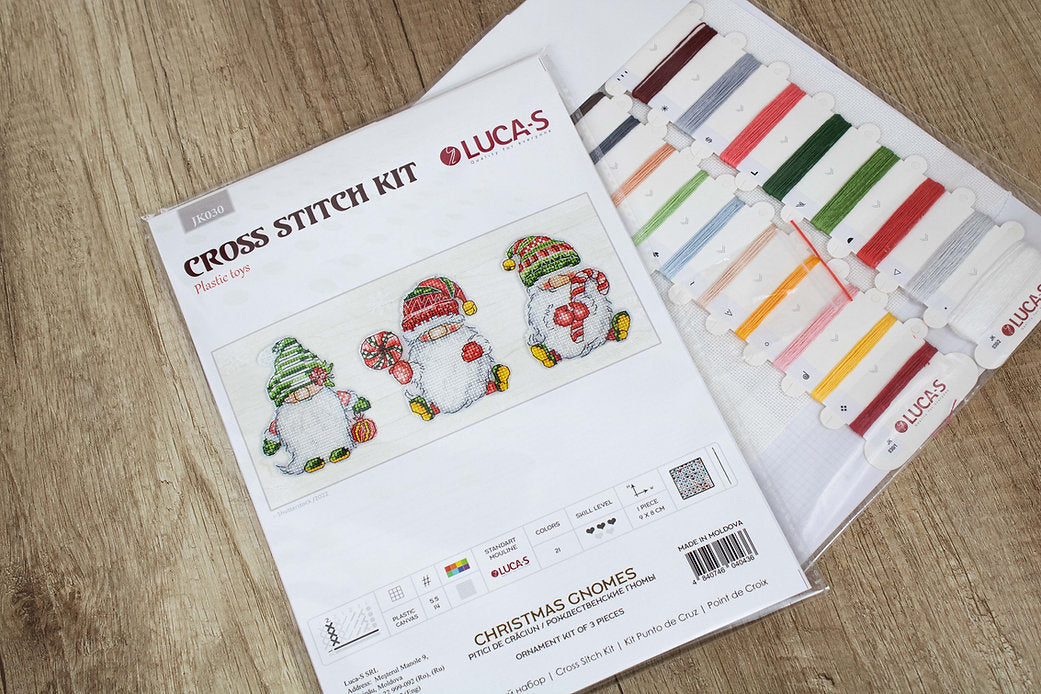 Christmas Gnomes JK030L Counted Cross-Stitch Kit featuring colorful threads, Aida canvas, and needle for festive crafting.