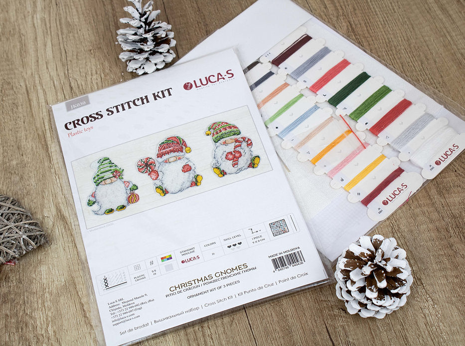 Christmas Gnomes JK030L Counted Cross-Stitch Kit featuring colorful threads, Aida canvas, and needle for festive crafting.