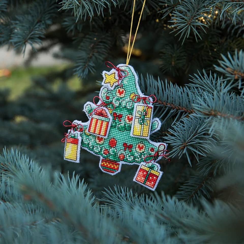 Colorful Christmas tree toy cross-stitch kit with plastic canvas, cotton floss, and felt materials.