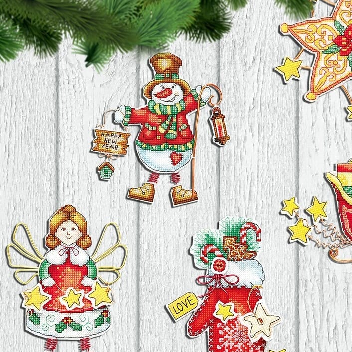 Colorful Christmas tree toy cross-stitch kit with plastic canvas, cotton floss, and felt materials.