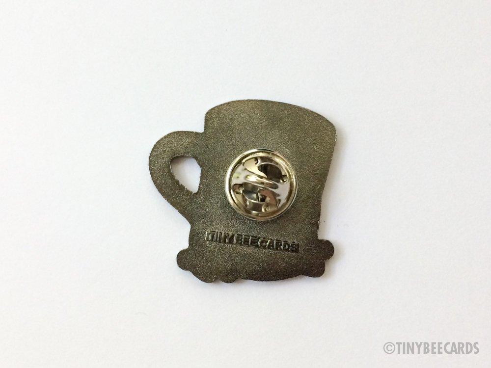 Cute hard enamel pin featuring kawaii coffee cup and coffee beans with pun text 'meant to bean'.