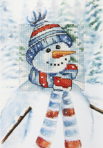 Complete counted cross stitch kit featuring a snowman design, including Zweigart aida fabric, DMC threads, embellished card, and accessories.