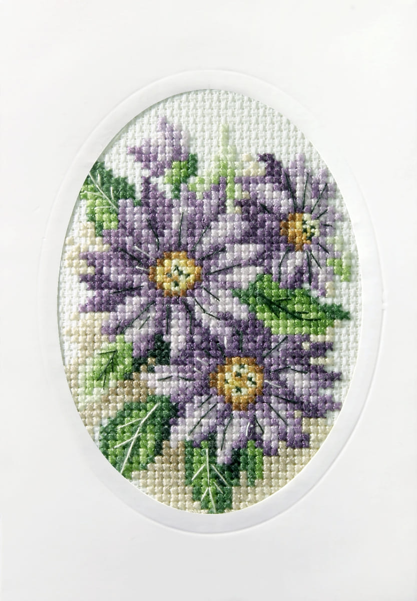 Complete cross stitch kit featuring violet flowers, includes fabric, threads, card, and instructions.