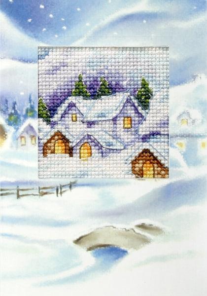 Complete cross stitch kit featuring a winter landscape design, including Zweigart aida fabric, DMC threads, embellished card, and instructions.