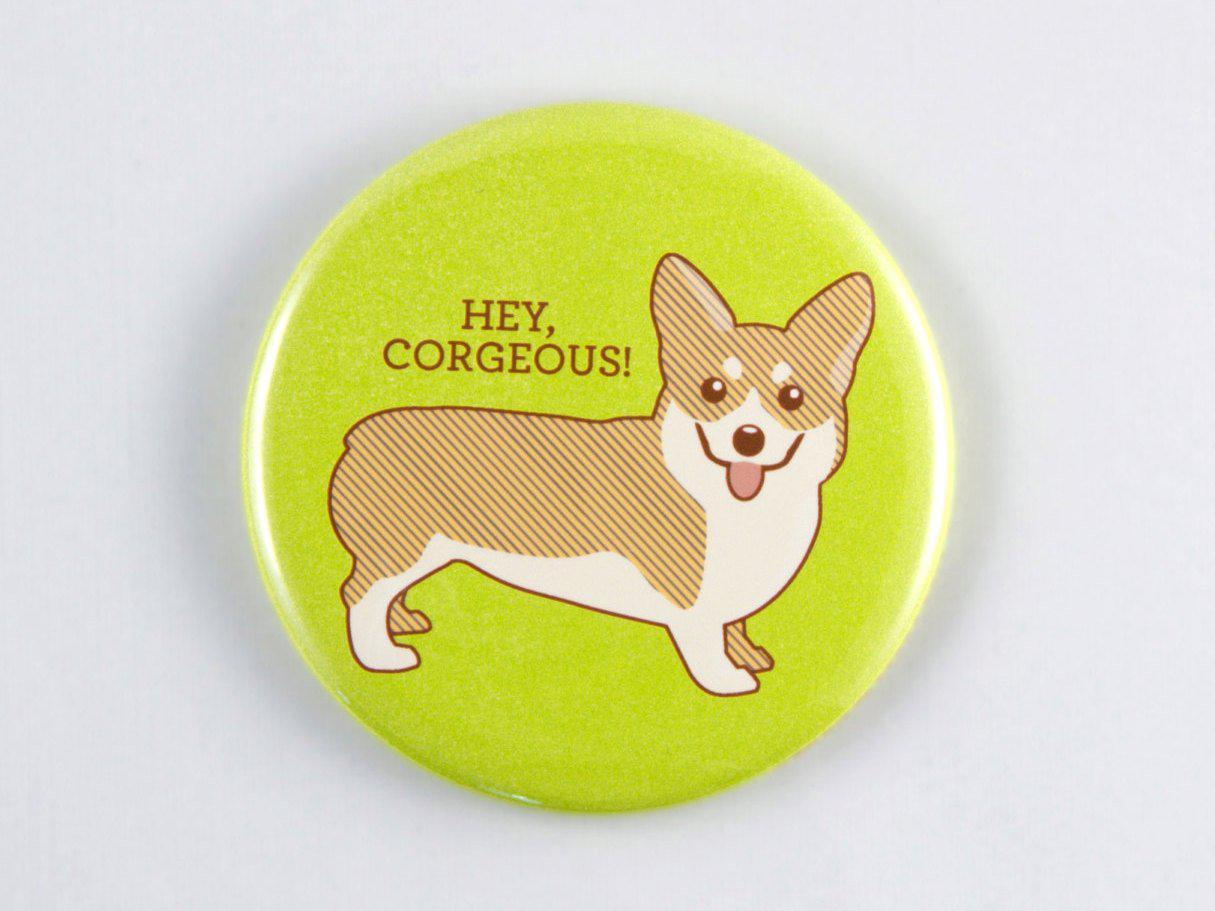 A round 2.25-inch button featuring a cute Corgi illustration with the text 'Hey Corgeous!' in vibrant colors.