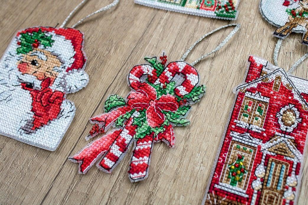 Counted Cross Stitch Kit Christmas Toys Kit 2 L8002 featuring colorful threads, Aida canvas, and needle for holiday crafting.