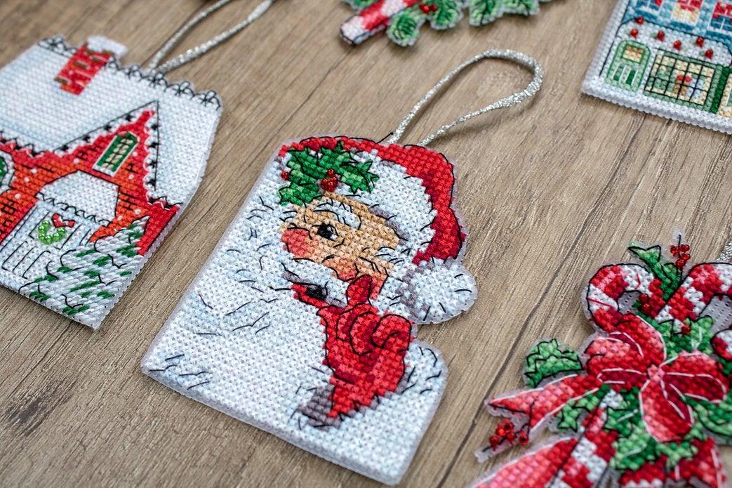 Counted Cross Stitch Kit Christmas Toys Kit 2 L8002 featuring colorful threads, Aida canvas, and needle for holiday crafting.