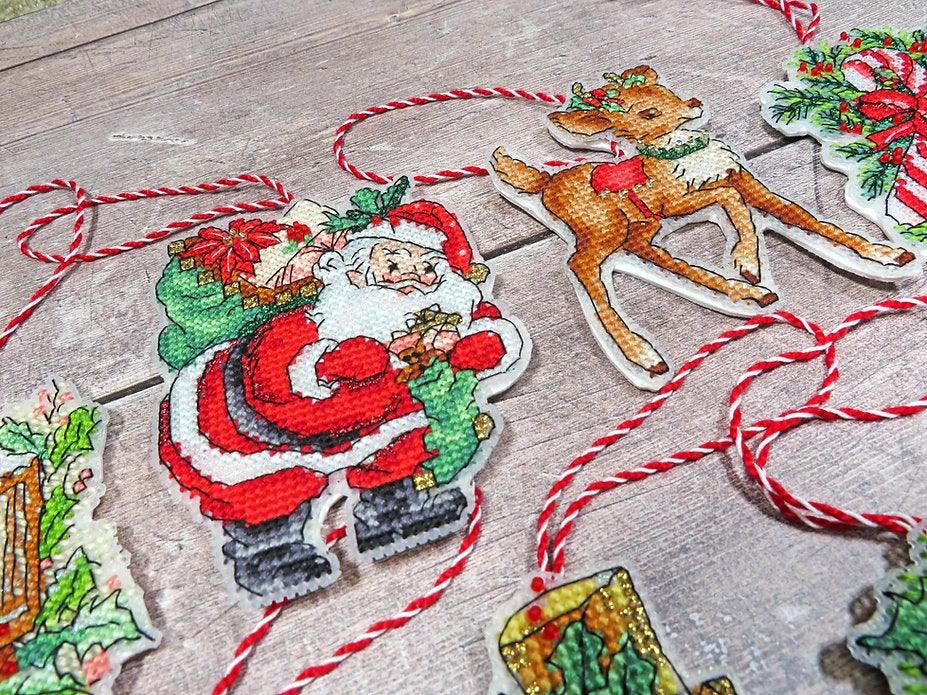 Counted Cross Stitch Kit Christmas toys kit nr.1 Leti966 featuring colorful threads, canvas, and accessories for holiday crafting.