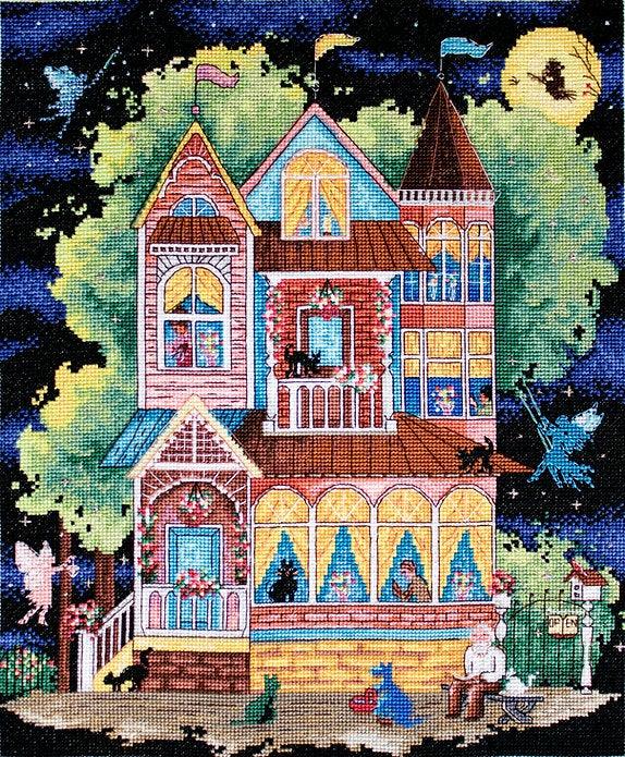 Counted cross stitch kit featuring a fairy tale house design with colorful threads and Aida canvas.