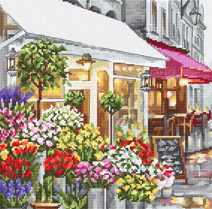 Counted Cross Stitch Kit Flower Shop Leti986 featuring colorful threads, canvas, and needle for crafting.