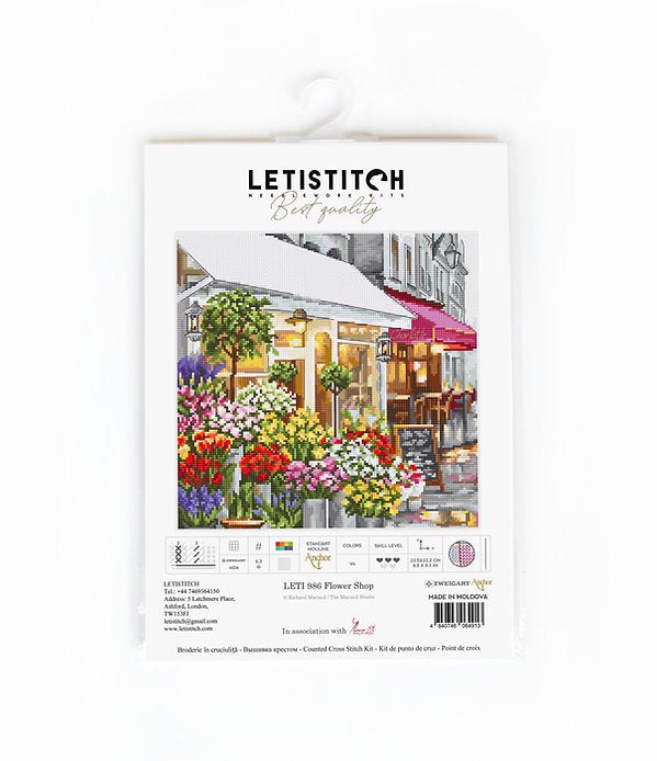 Counted Cross Stitch Kit Flower Shop Leti986 featuring colorful threads, canvas, and needle for crafting.