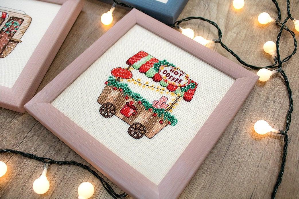 Counted Cross Stitch Kit Happy Holidays L8001 featuring colorful threads, canvas, and needle for festive stitching.