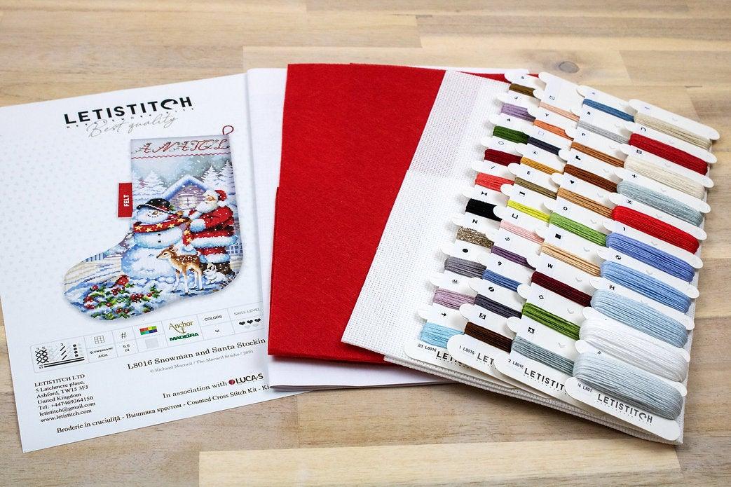 Counted Cross Stitch Kit featuring a Snowman and Santa design, includes colorful threads and canvas.