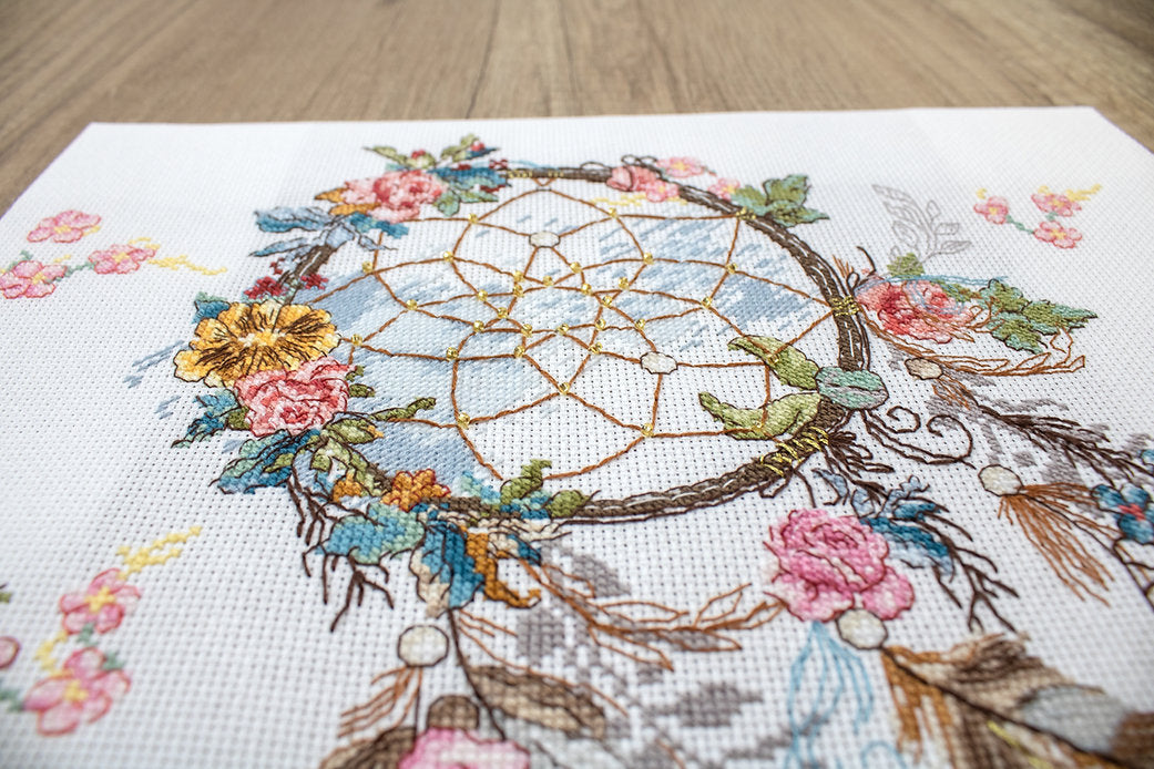 Counted Cross Stitch Kit Spring Dreams L8035 featuring colorful threads, canvas, and needle for crafting.