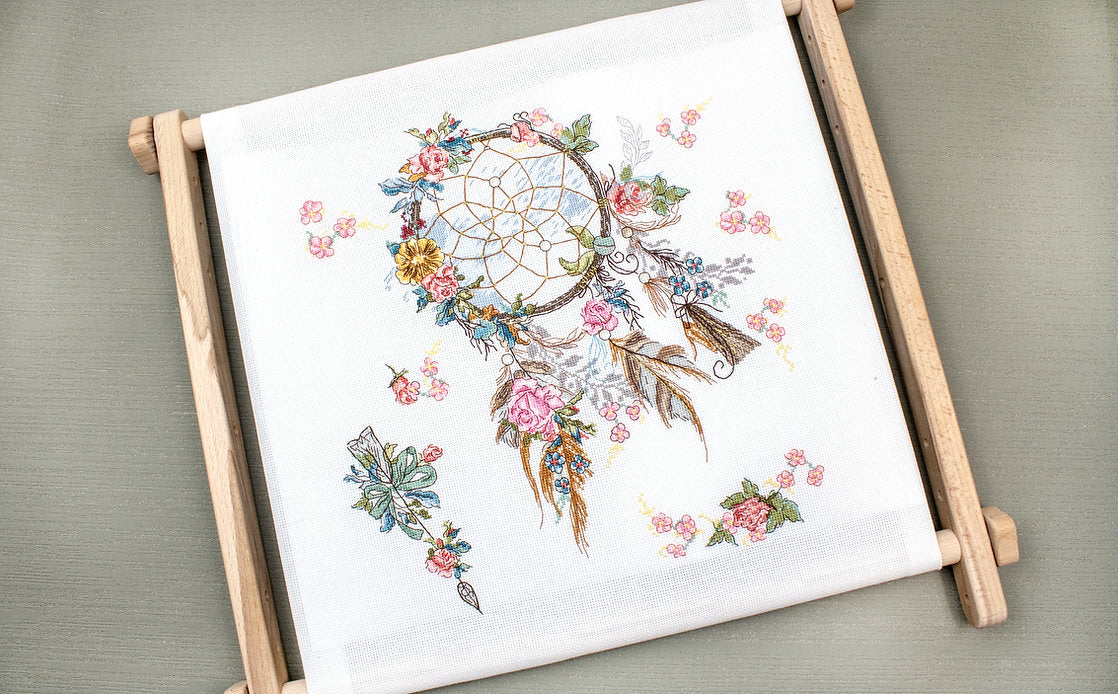 Counted Cross Stitch Kit Spring Dreams L8035 featuring colorful threads, canvas, and needle for crafting.