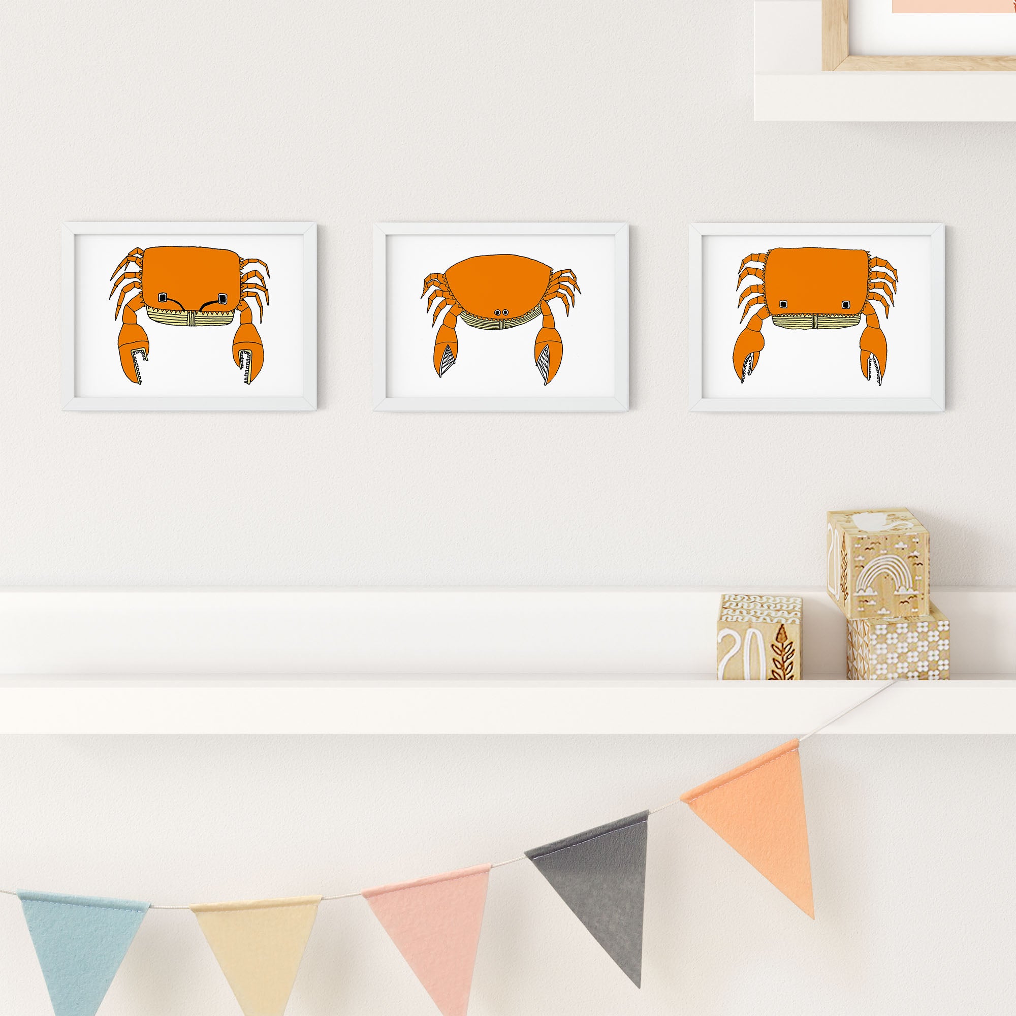 A colorful illustrated print of a crab with antenna-like eyes, showcasing playful design elements.