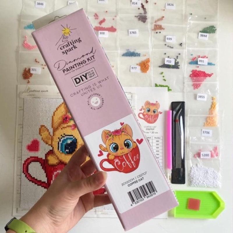 Crafting Spark Diamond Painting Kit featuring a cute kitten design, complete with tools and colorful acrylic diamonds.