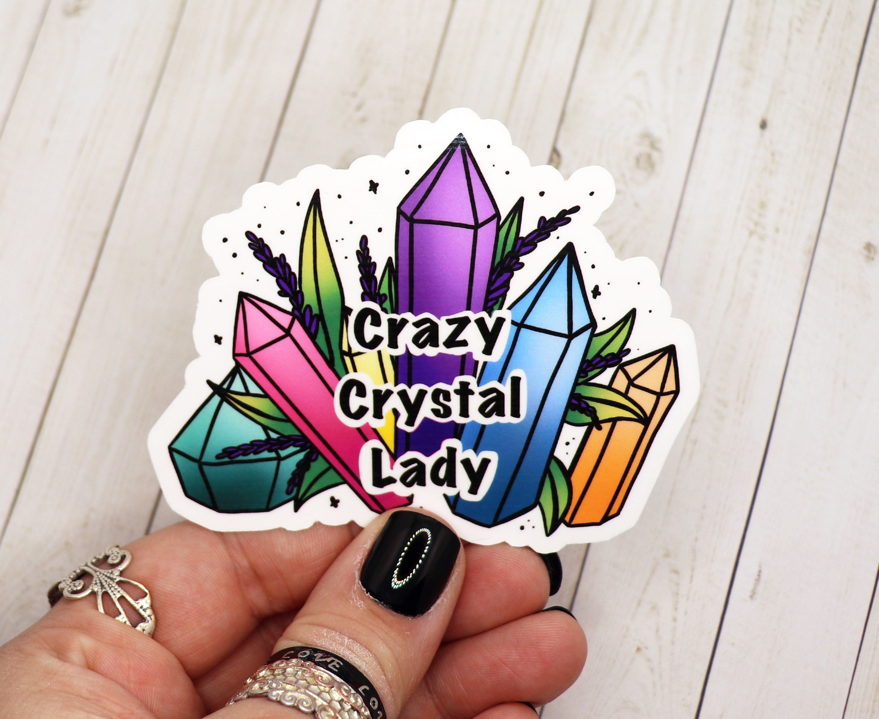 A vibrant Crazy Crystal Lady vinyl sticker featuring a whimsical design, perfect for personalizing various items.