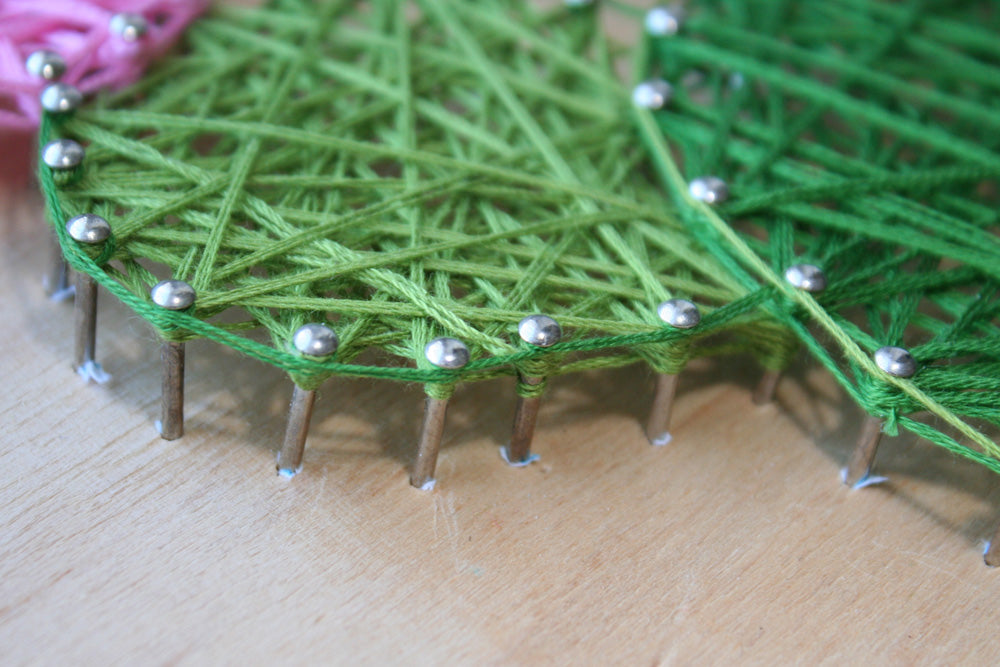 Creative Kit/String Art Cactus ABC-002 featuring wooden base, colorful threads, and nails for crafting.