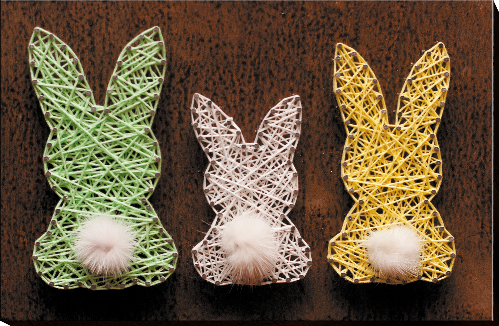 Creative Kit/String Art Little Hares ABC-013 featuring wooden base, colorful threads, and nails for crafting.