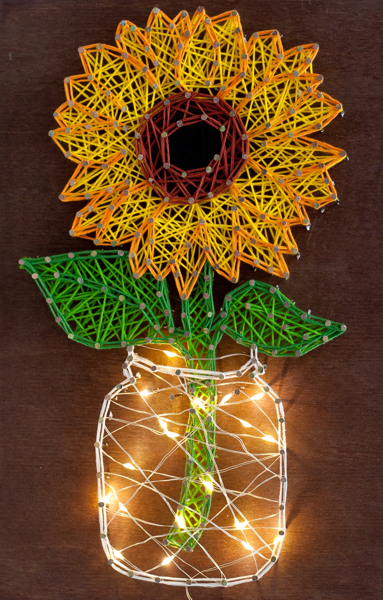 Creative Kit/String Art Sunflower ABC-018 with wooden base, colorful threads, and nails for crafting.