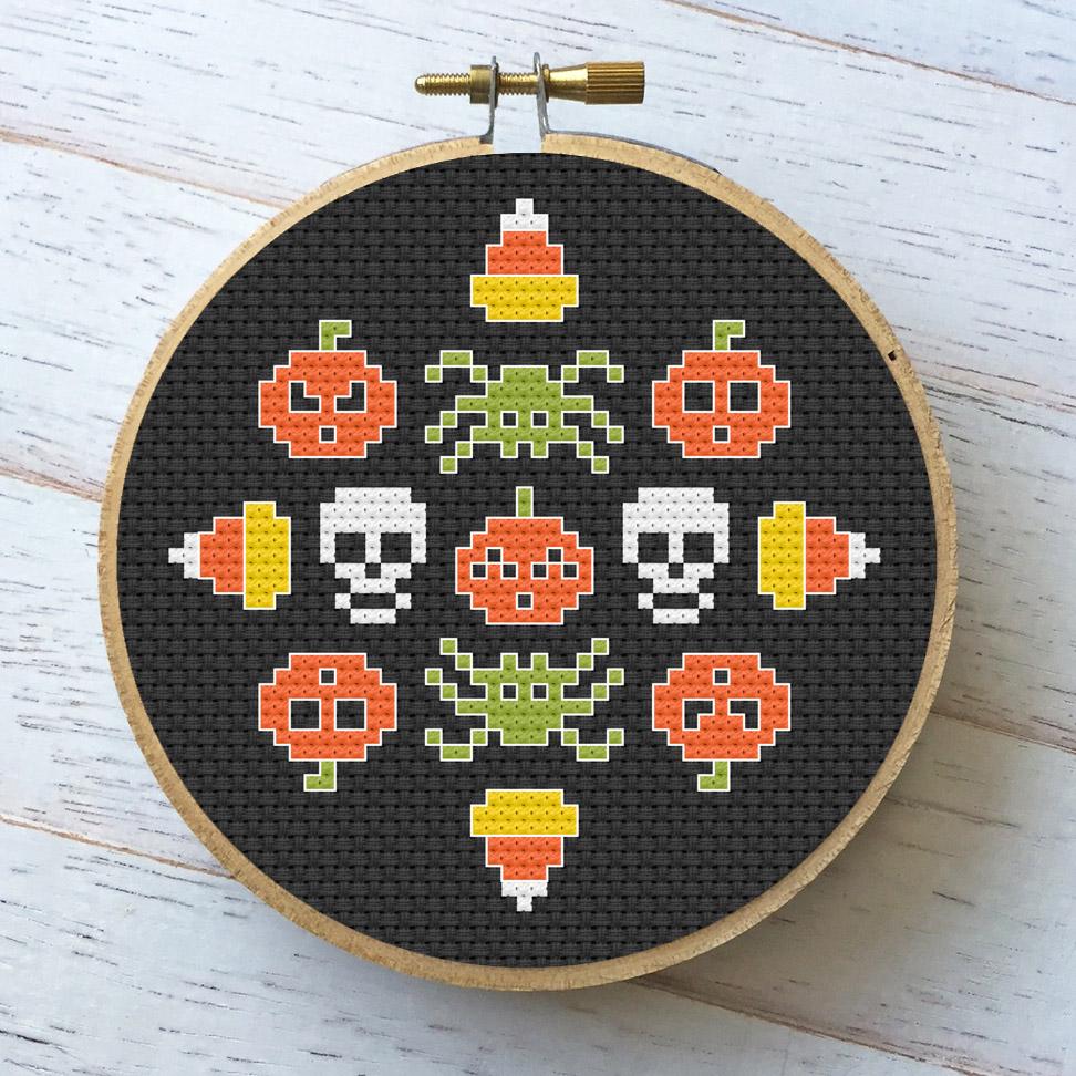 Creepy Glow Counted Cross Stitch Kit featuring glow-in-the-dark threads and lime green Aida fabric, perfect for Halloween crafting.