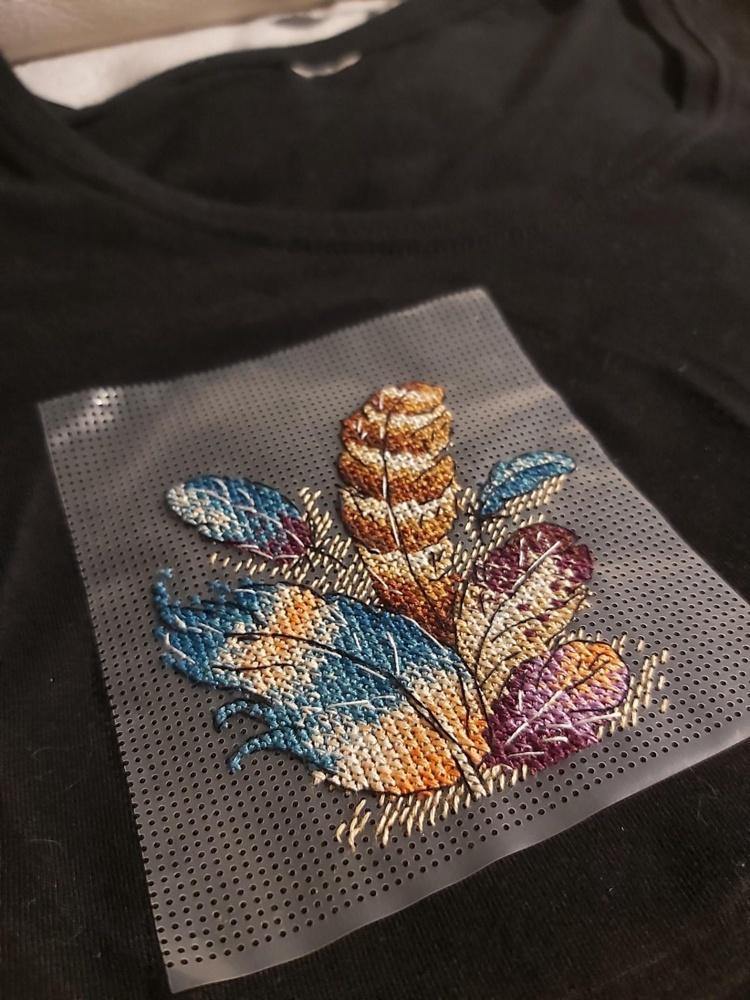 Cross stitch kit featuring Airy Bouquet design with water-soluble canvas and colorful threads, perfect for personalizing clothing.