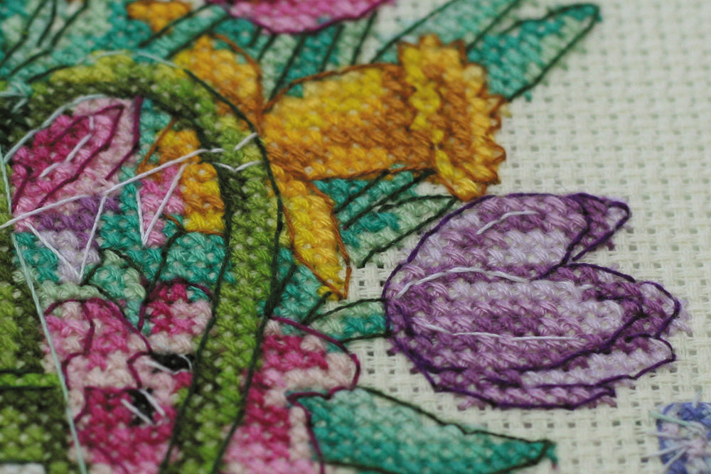 Cross-stitch kit featuring berry cupcakes design with cotton canvas and colorful floss.