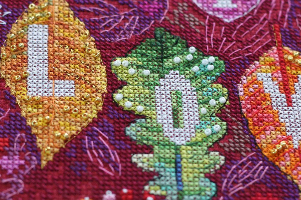 Colorful Autumn Cross-stitch Kit AH-128 featuring vibrant threads, canvas, and decorative elements for crafting.