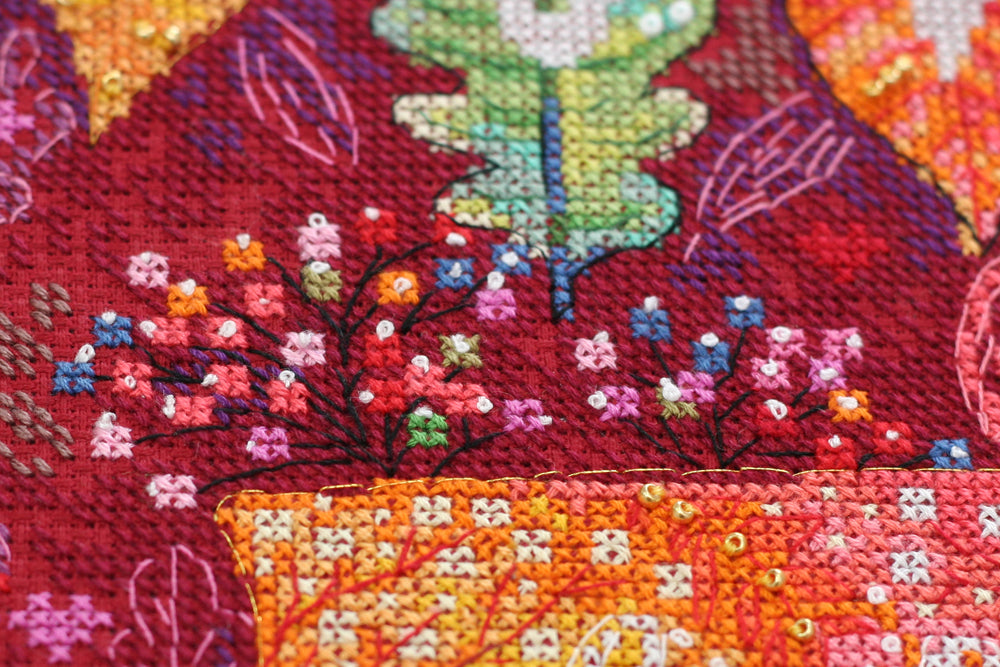 Colorful Autumn Cross-stitch Kit AH-128 featuring vibrant threads, canvas, and decorative elements for crafting.