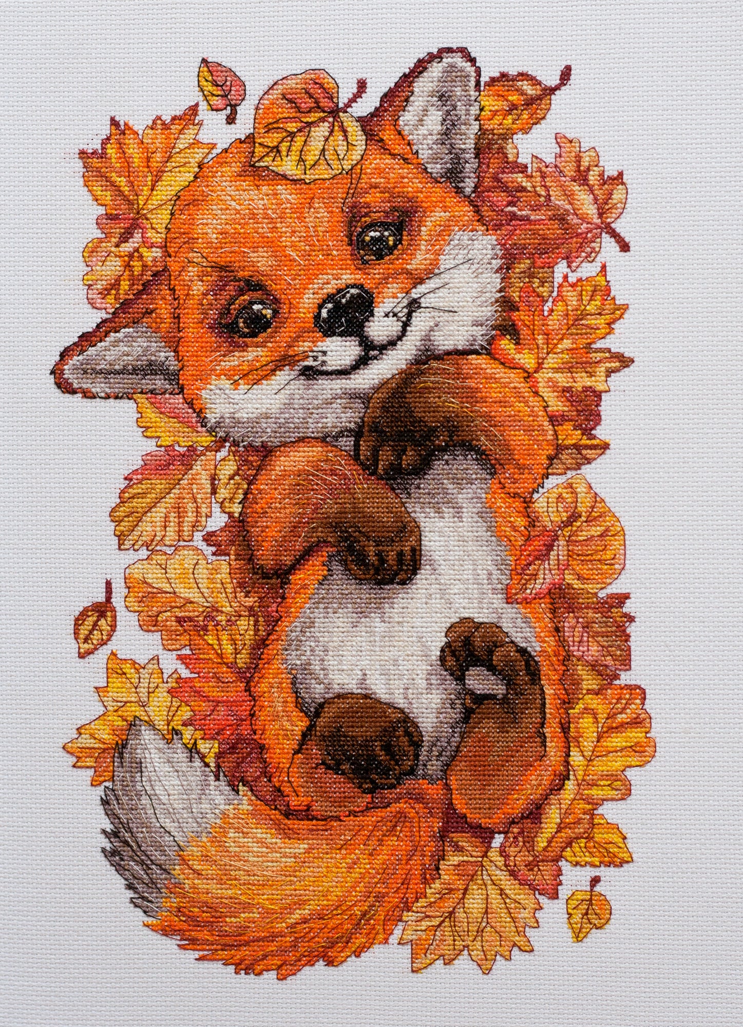 Cross-stitch kit First autumn AH-112 featuring cotton canvas, colorful floss, and needles for crafting autumn-themed art.