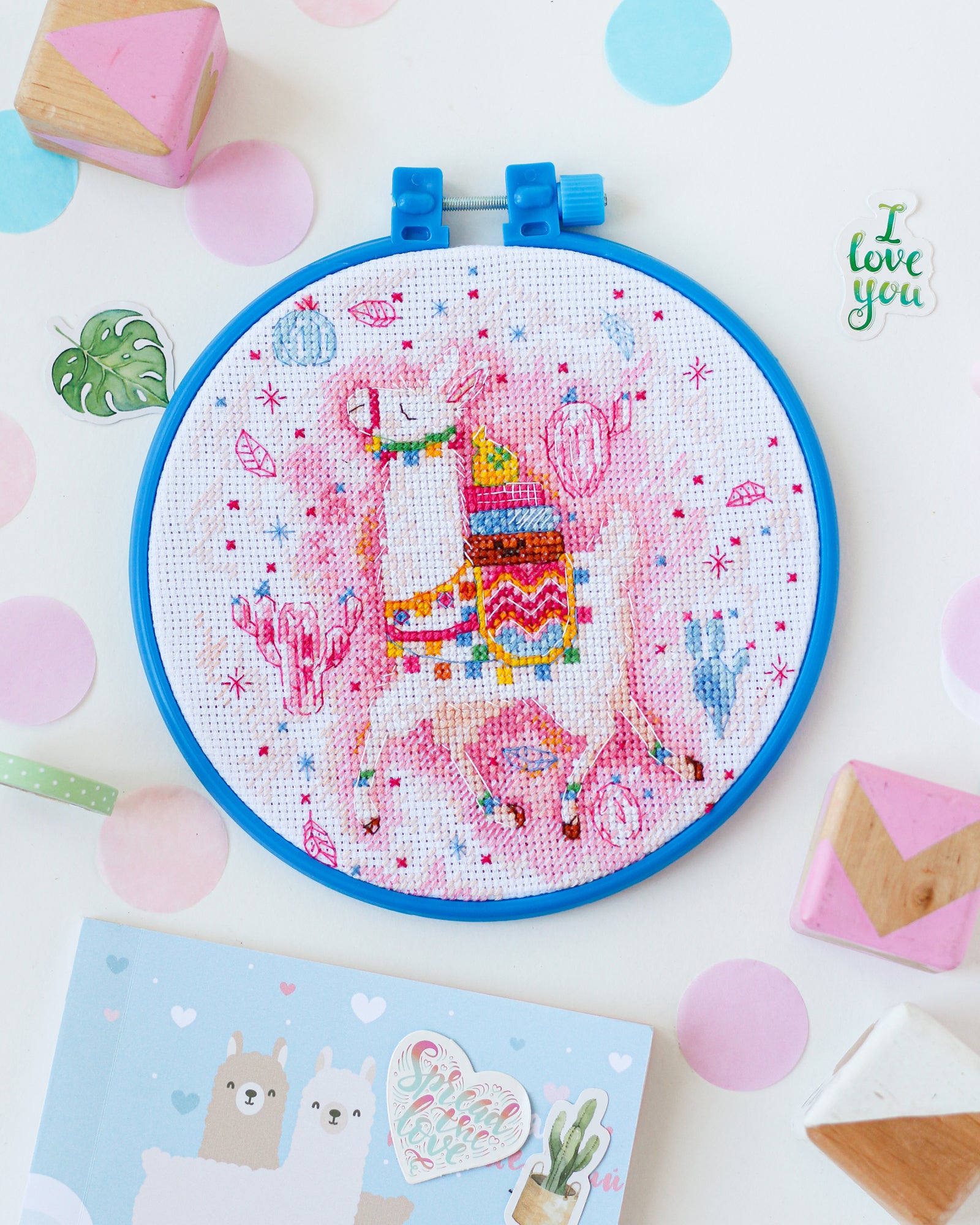 Cross-stitch kit featuring a llama design, includes cotton canvas, floss, and instructions.