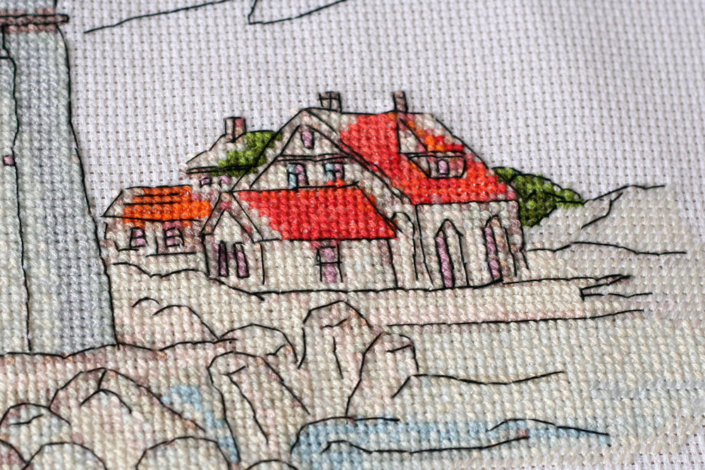 Cross-stitch kit Lighthouse light AH-109 featuring cotton canvas, colorful floss, and needles for crafting.