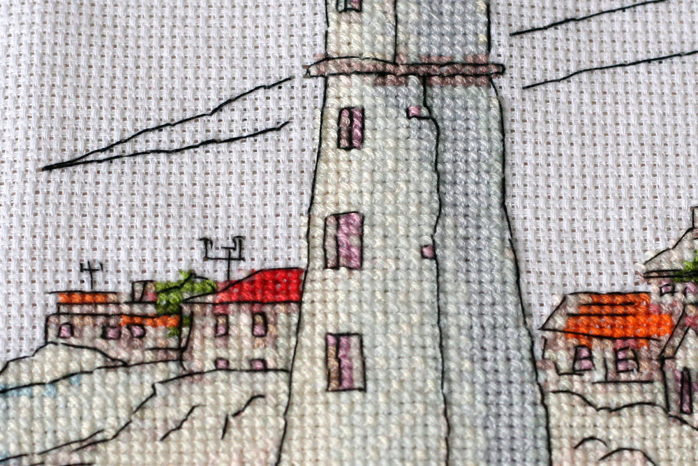 Cross-stitch kit Lighthouse light AH-109 featuring cotton canvas, colorful floss, and needles for crafting.