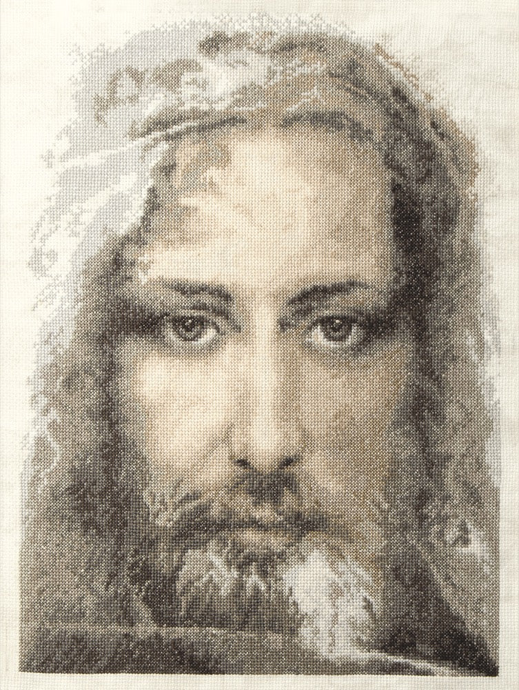 Cross-stitch kit M-202C featuring the Turin Shroud design, including fabric, threads, and instructions.